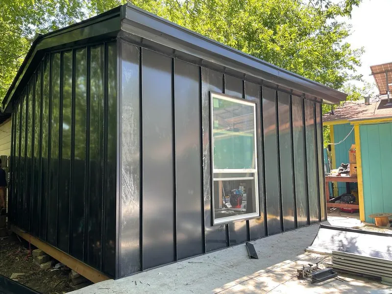 Black standing seam metal wall panels for Roof Inspection in Friendswood