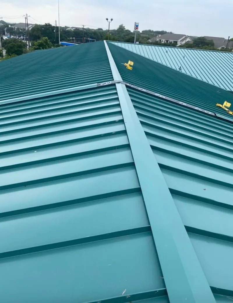 Green commercial metal roof ridge and valley for Metal Roof Repair in Friendswood